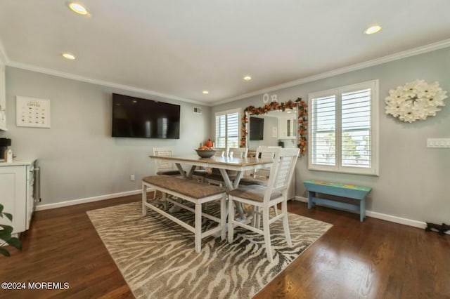 dining room with dark hardwood / wood-style floors and ornamental molding