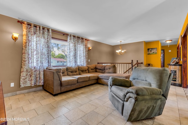 tiled living room featuring an inviting chandelier