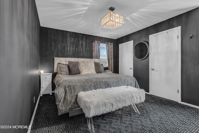 bedroom featuring a chandelier, vaulted ceiling, and dark colored carpet