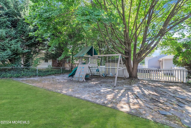 view of playground with a lawn