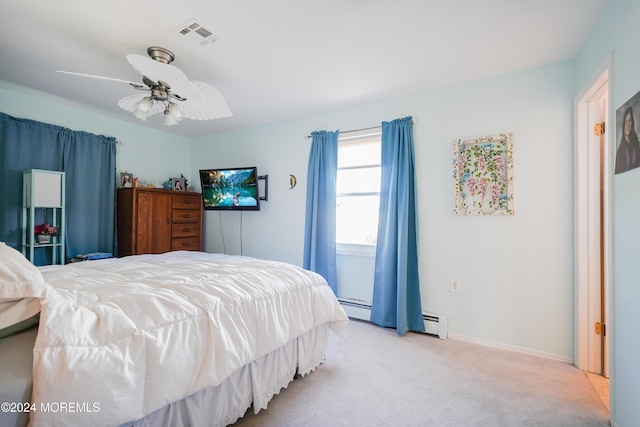 bedroom with a baseboard radiator and light colored carpet