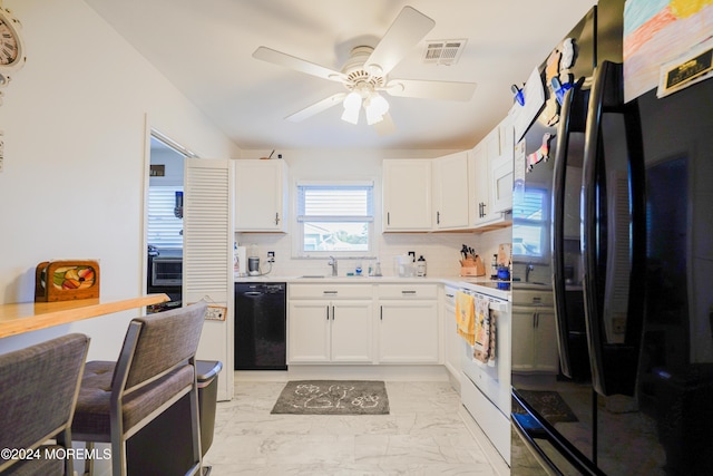 kitchen featuring black appliances, sink, backsplash, ceiling fan, and white cabinets