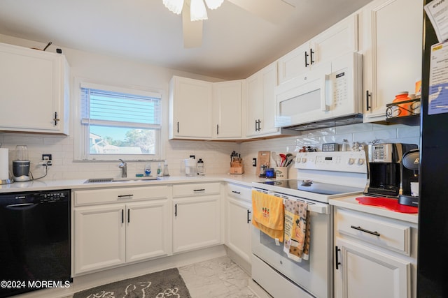 kitchen featuring sink, white appliances, white cabinetry, and decorative backsplash