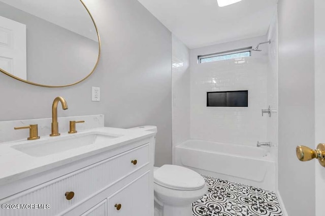 full bathroom with tile patterned flooring, vanity, toilet, and tiled shower / bath