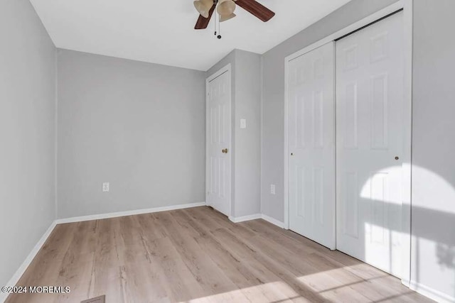 unfurnished bedroom with a closet, ceiling fan, and light hardwood / wood-style flooring