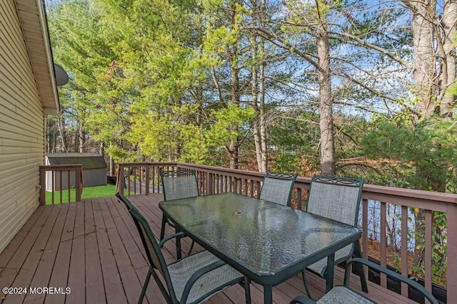 wooden deck with a storage unit