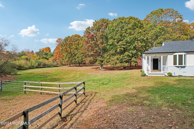 view of yard with a rural view