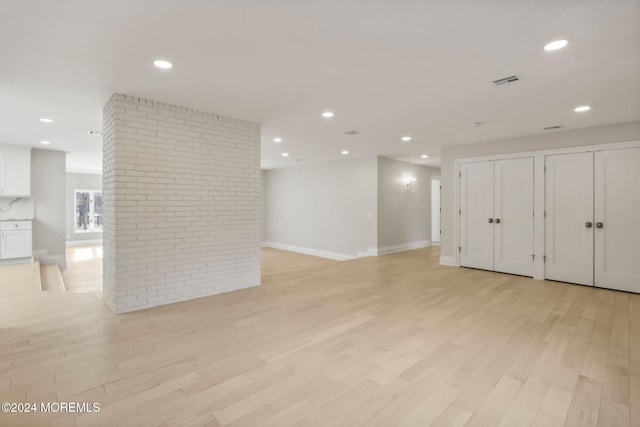 unfurnished room with light hardwood / wood-style flooring