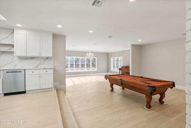 recreation room with light wood-type flooring, an inviting chandelier, and pool table