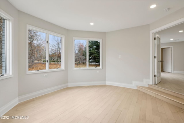 unfurnished room featuring light hardwood / wood-style flooring