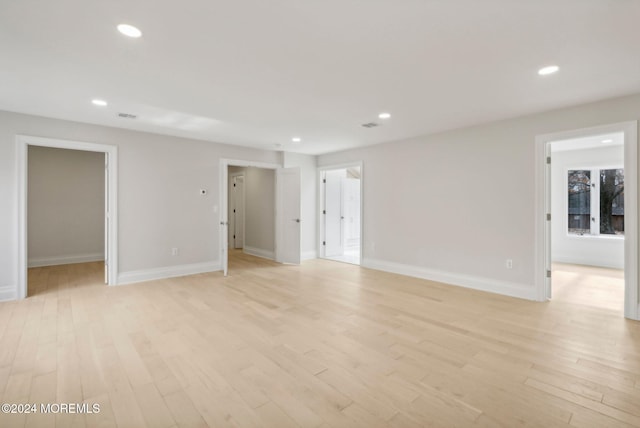 spare room with light hardwood / wood-style flooring