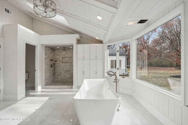 bathroom with separate shower and tub, tile patterned flooring, and vaulted ceiling