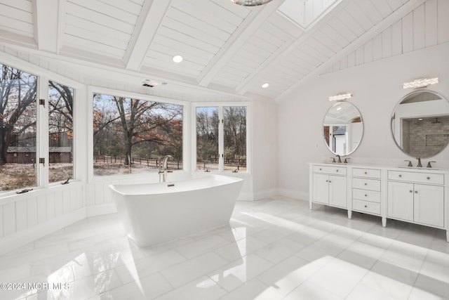 bathroom with vanity, lofted ceiling with beams, a tub, and wood ceiling