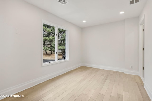 unfurnished room featuring light hardwood / wood-style floors