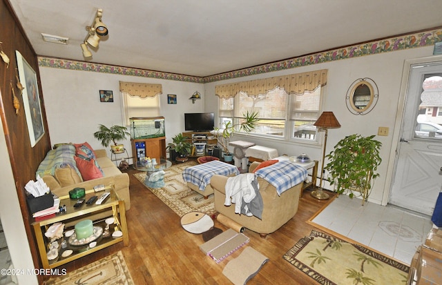 living room featuring hardwood / wood-style floors and baseboard heating