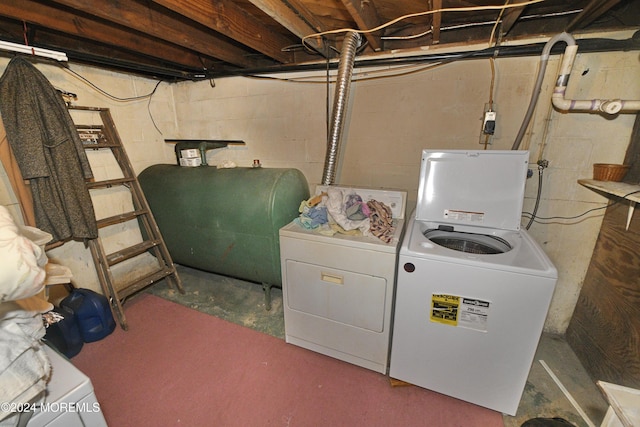 clothes washing area featuring independent washer and dryer