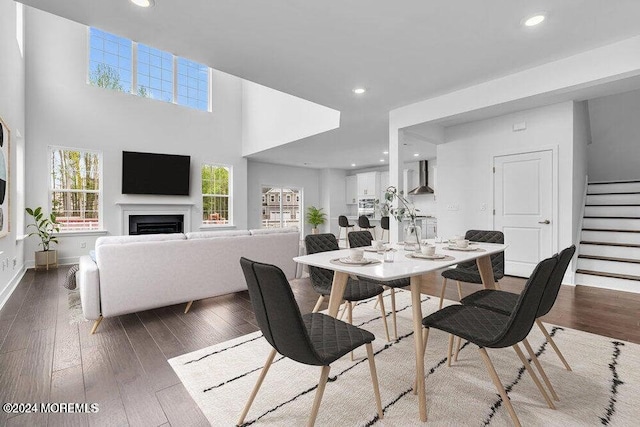 dining space featuring dark hardwood / wood-style floors and a healthy amount of sunlight