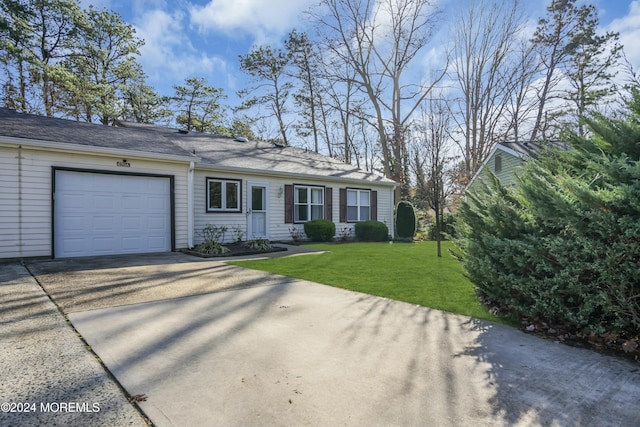 ranch-style house with a front yard and a garage