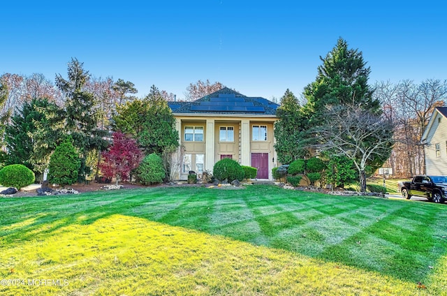 view of front of house with a front lawn