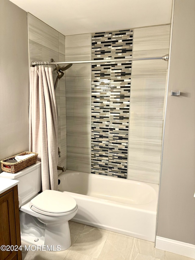 full bathroom featuring tile patterned flooring, shower / bath combo, vanity, and toilet