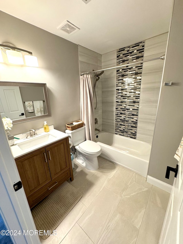 full bathroom with tile patterned floors, vanity, shower / tub combo, and toilet