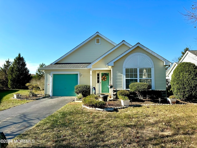 view of front facade featuring a garage and a front lawn