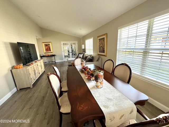 dining area with french doors, dark wood-type flooring, and vaulted ceiling