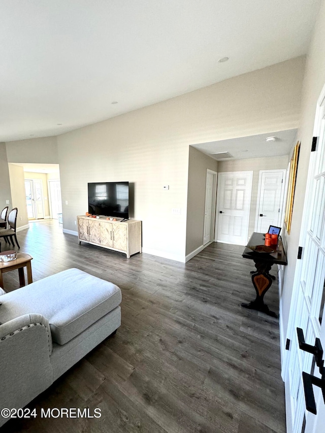 living room with dark hardwood / wood-style floors