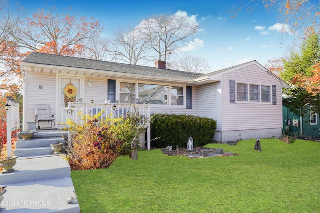 ranch-style home with a porch and a front yard