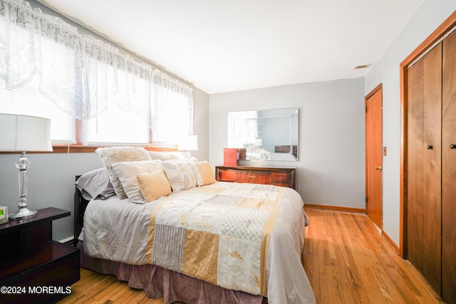 bedroom featuring light wood-type flooring