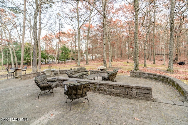 view of patio featuring a fire pit