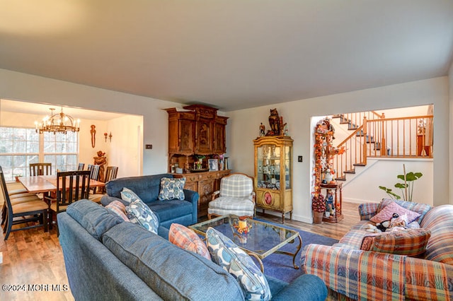 living room featuring hardwood / wood-style flooring and a notable chandelier