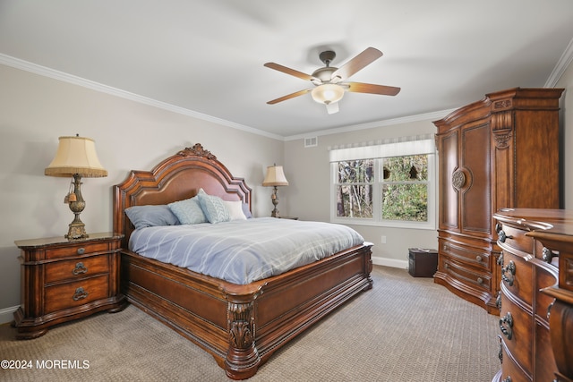 carpeted bedroom featuring ceiling fan and ornamental molding