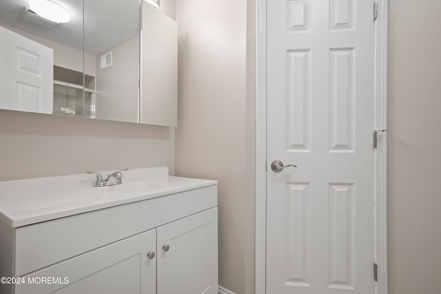 bathroom with vanity and walk in shower