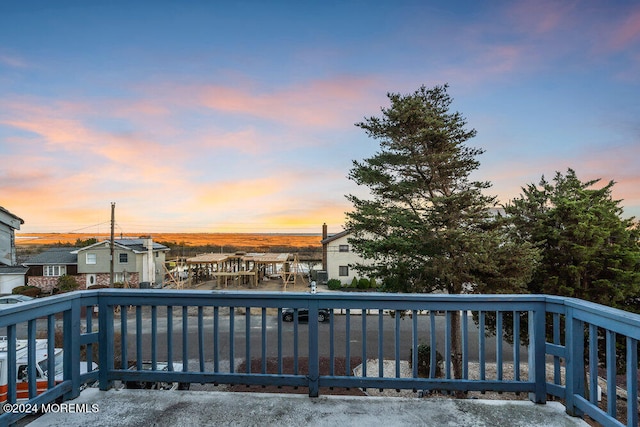 view of pool at dusk