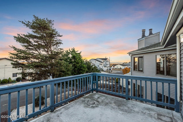 view of balcony at dusk