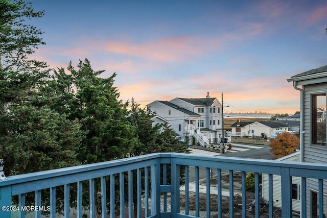 view of balcony at dusk