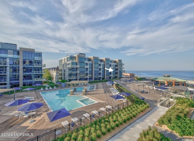 view of pool with a water view