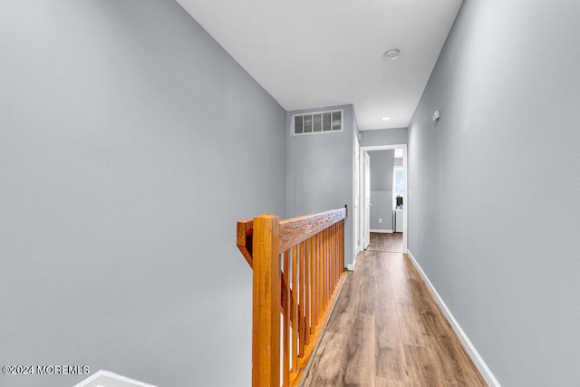 corridor featuring wood-type flooring