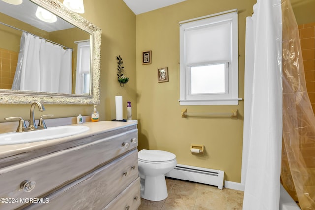 bathroom featuring tile patterned flooring, vanity, a baseboard radiator, and toilet