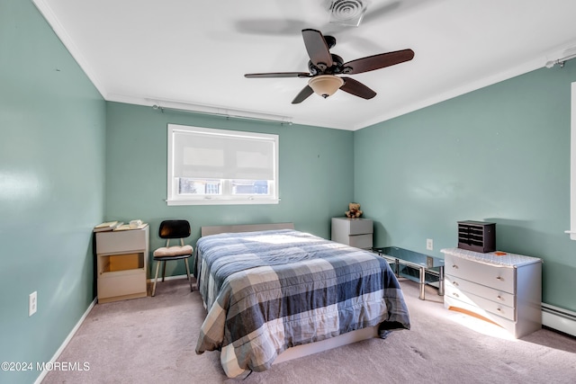 bedroom featuring ceiling fan, light colored carpet, ornamental molding, and a baseboard heating unit