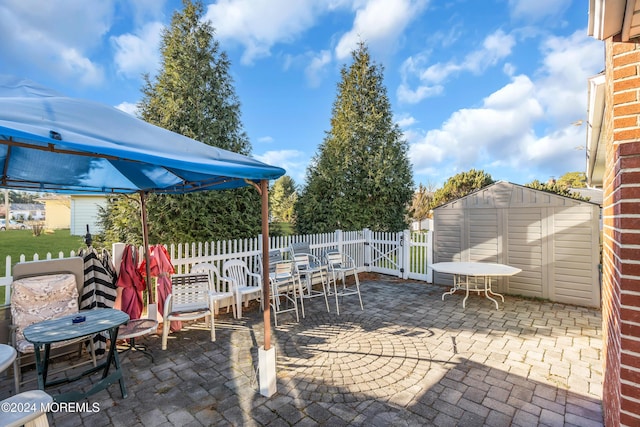 view of patio featuring a storage unit