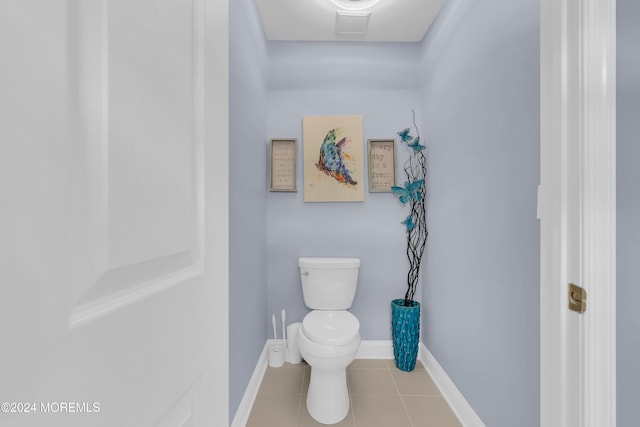 bathroom featuring tile patterned flooring and toilet