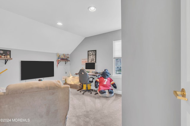 carpeted living room featuring vaulted ceiling