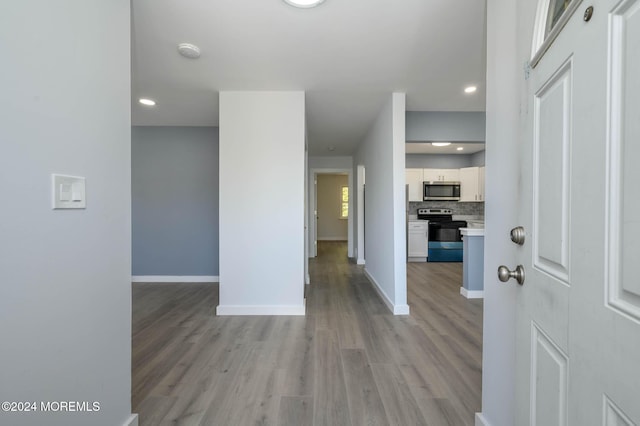 foyer entrance with light hardwood / wood-style flooring