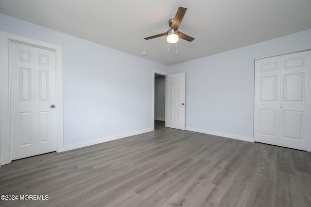 unfurnished bedroom featuring ceiling fan and hardwood / wood-style floors