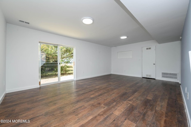 empty room featuring dark hardwood / wood-style floors