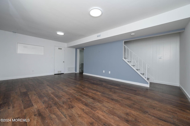 basement featuring dark hardwood / wood-style flooring