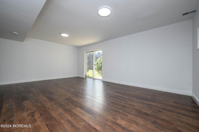 empty room featuring dark wood-type flooring