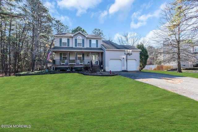 view of front facade with a garage, covered porch, and a front lawn